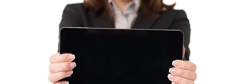 a tablet with analytic data sits on top of printed analytic data