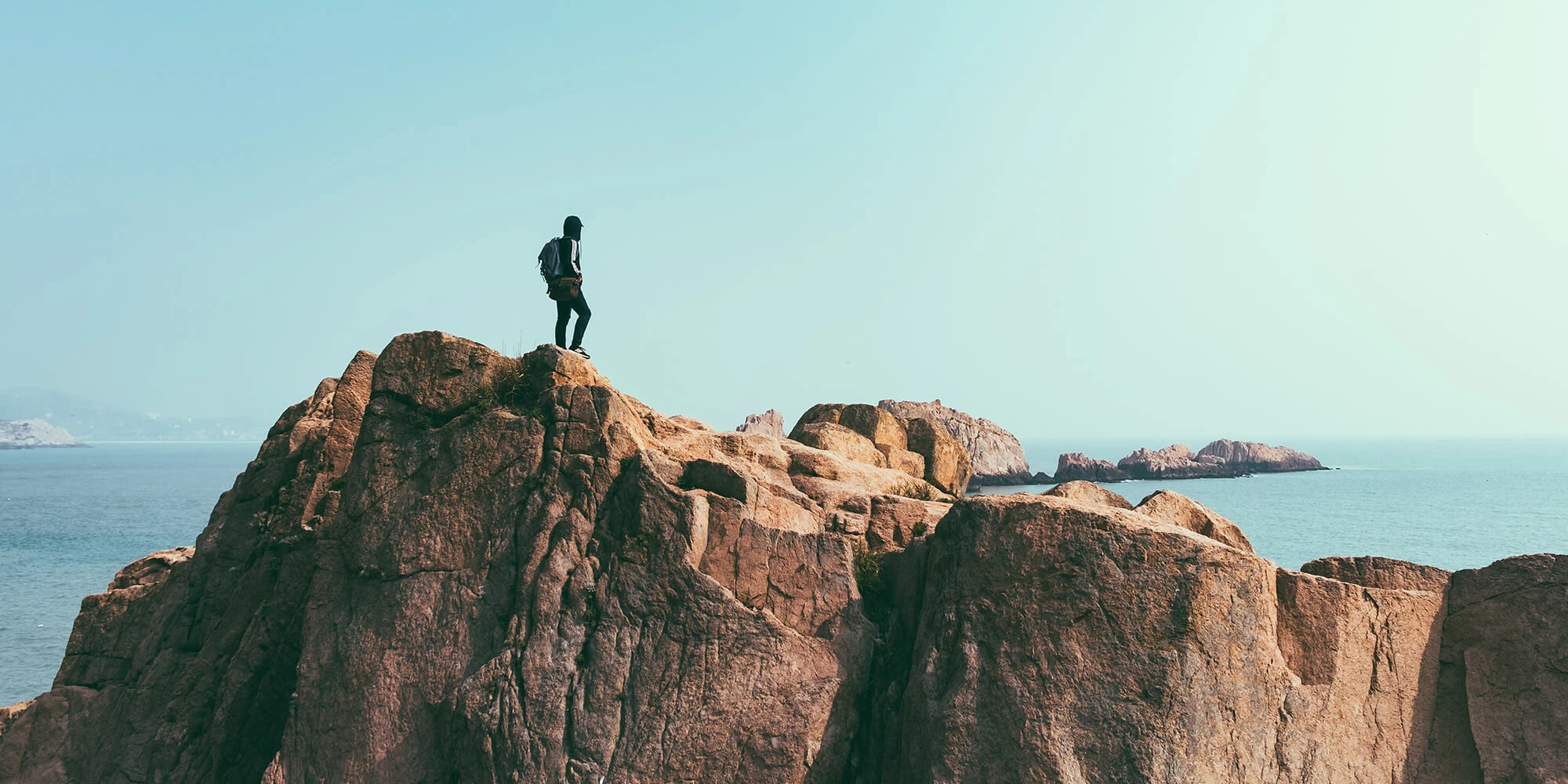 Man on a mountain cliff