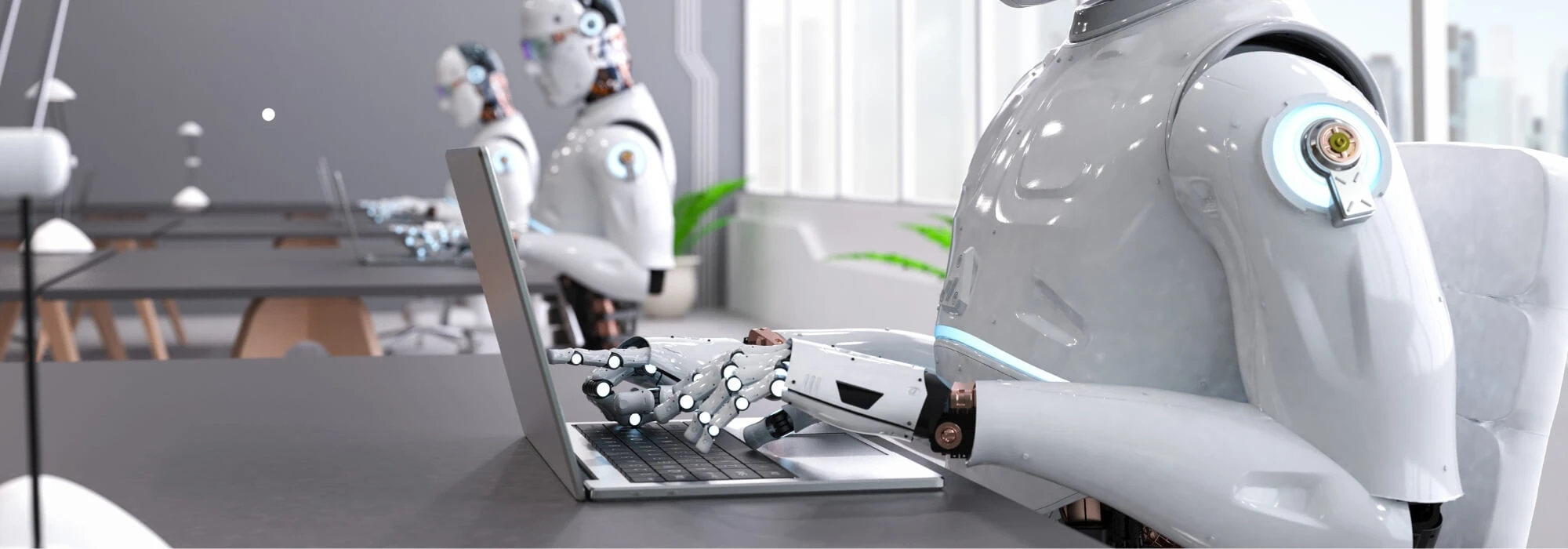 artificial intelligence types on laptops set up at desks in a room