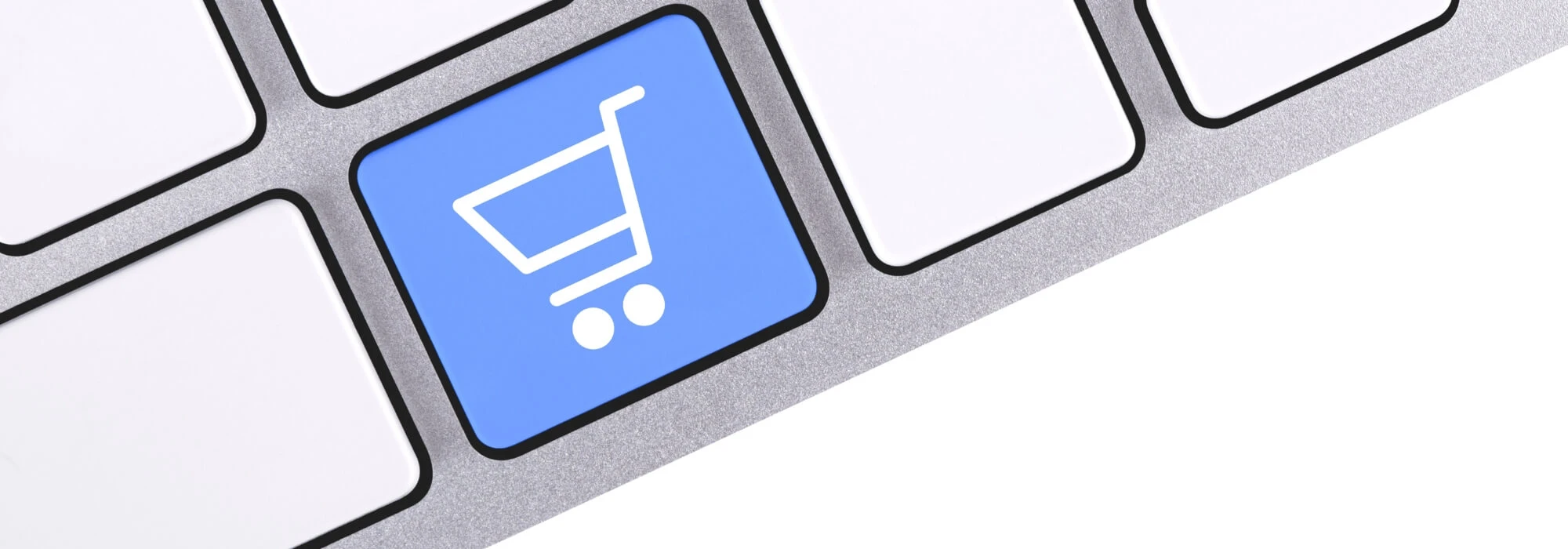 An e commerce shopping cart button showing as a blue button a keyboard