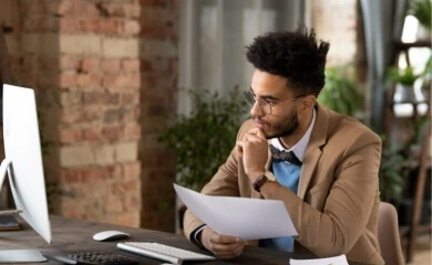 A person compares a data sheet